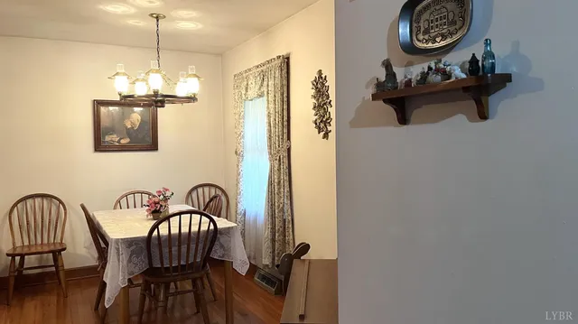 a view of room with window and wooden floor