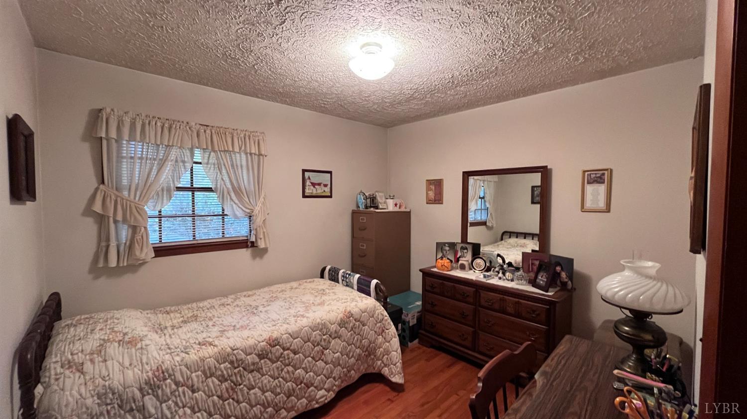 1091 Acorn Road Nathalie, VA 24577 - Photo 16 of 42 a bedroom with a bed and furniture