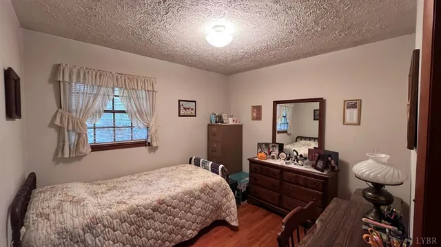 a bedroom with a bed and furniture