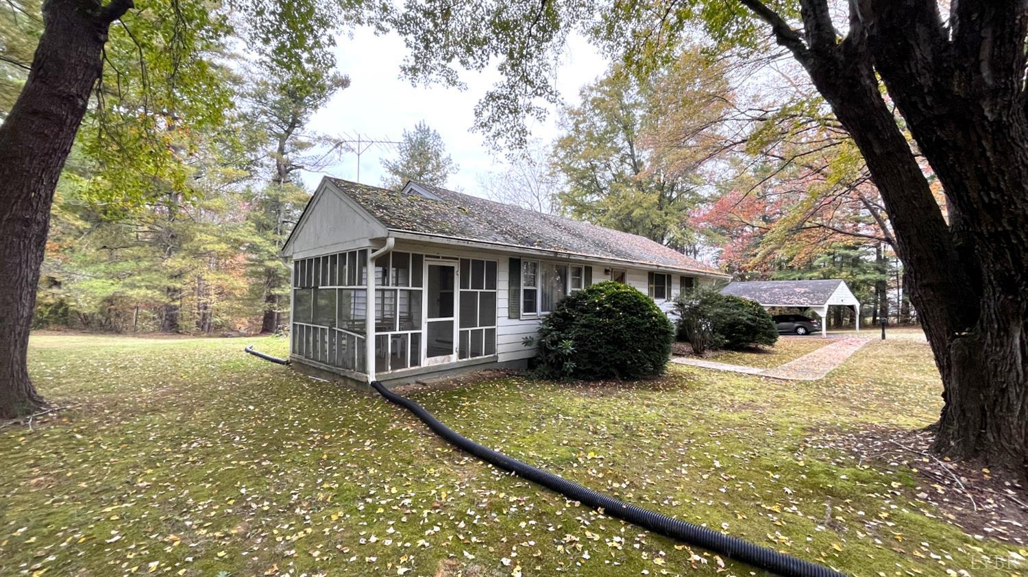 1091 Acorn Road Nathalie, VA 24577 - Photo 26 of 29 a view of a house with a yard covered in snow