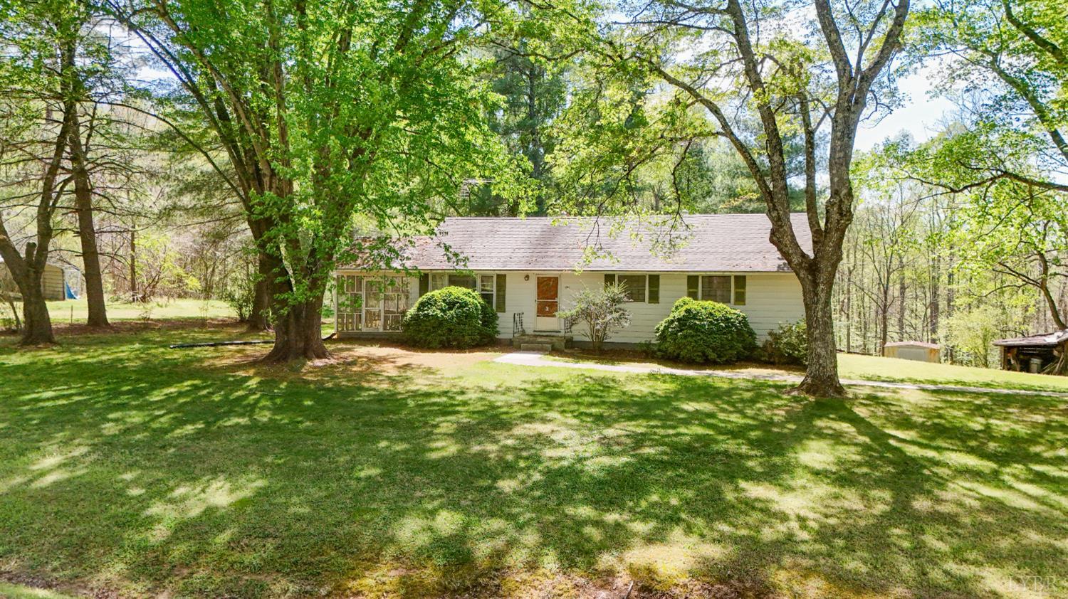 1091 Acorn Road Nathalie, VA 24577 - Photo 35 of 42 a front view of a house with a yard and tree s