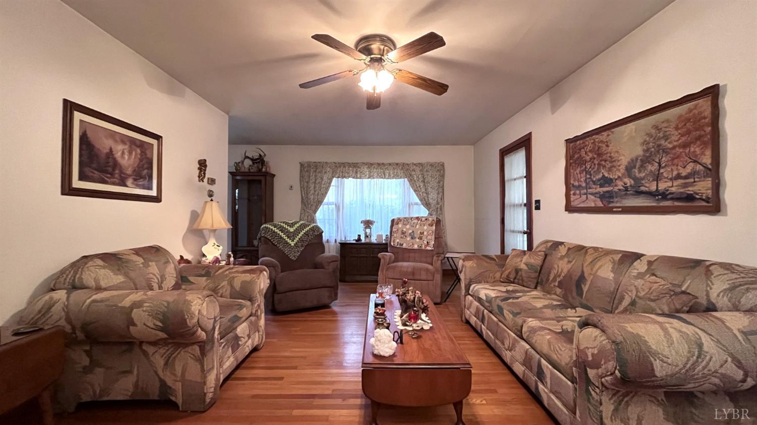 1091 Acorn Road Nathalie, VA 24577 - Photo 8 of 29 a living room with furniture and a large window