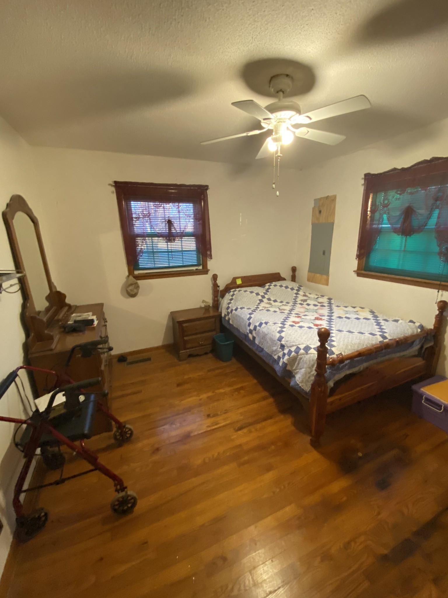 251 Rascal Town Road Loretto, TN 38469 - Photo 34 of 52 a bedroom with a bed and a chandelier