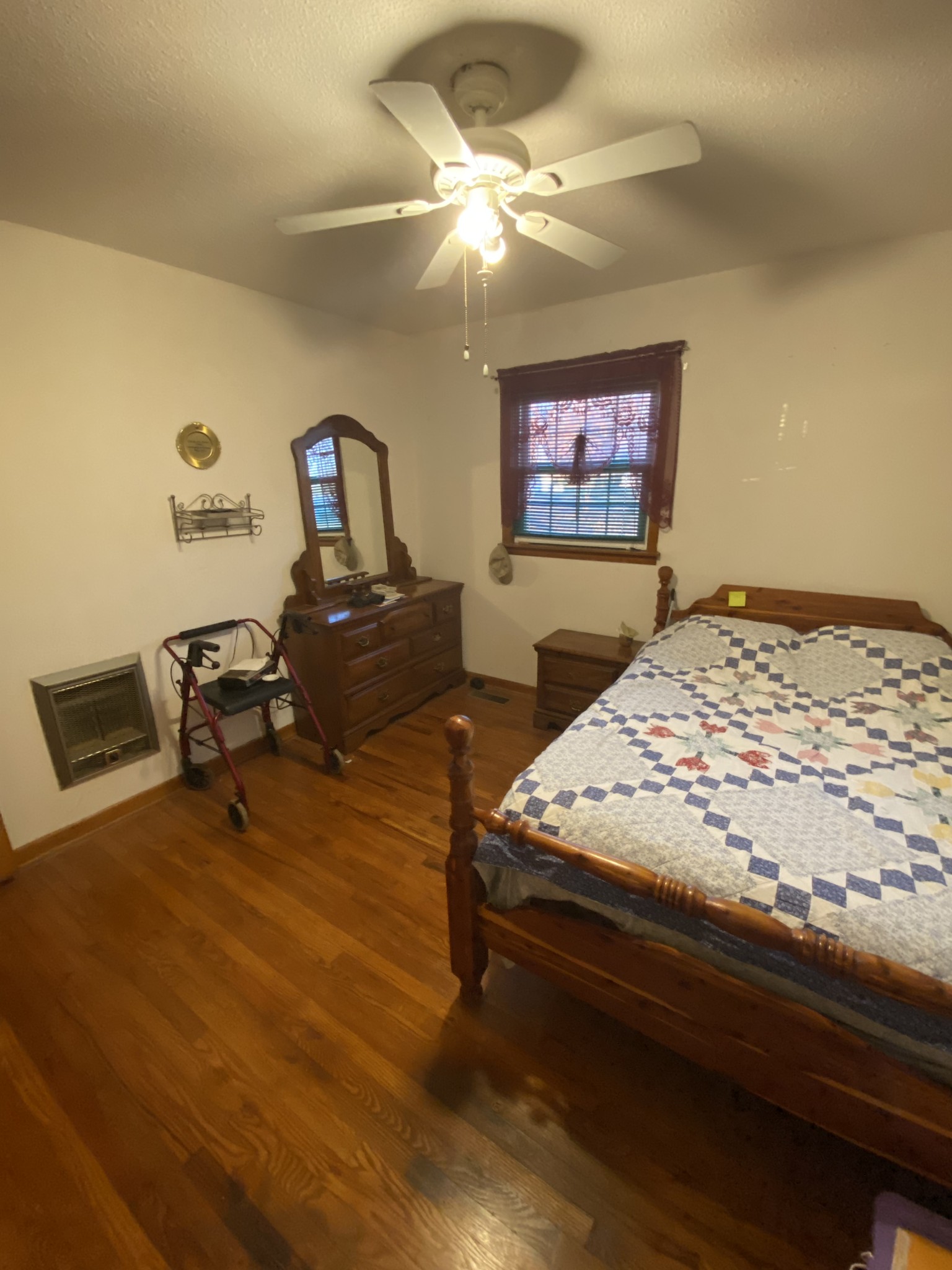 251 Rascal Town Road Loretto, TN 38469 - Photo 35 of 52 a bedroom with a bed and a chandelier