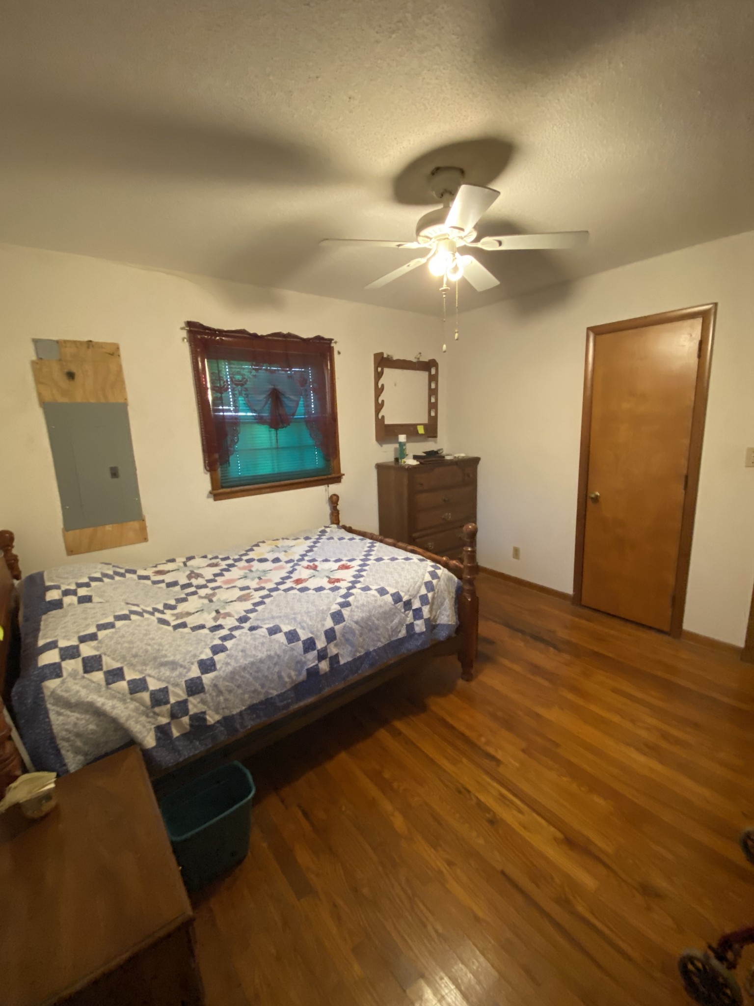 251 Rascal Town Road Loretto, TN 38469 - Photo 36 of 52 a bedroom with a bed and wooden floor