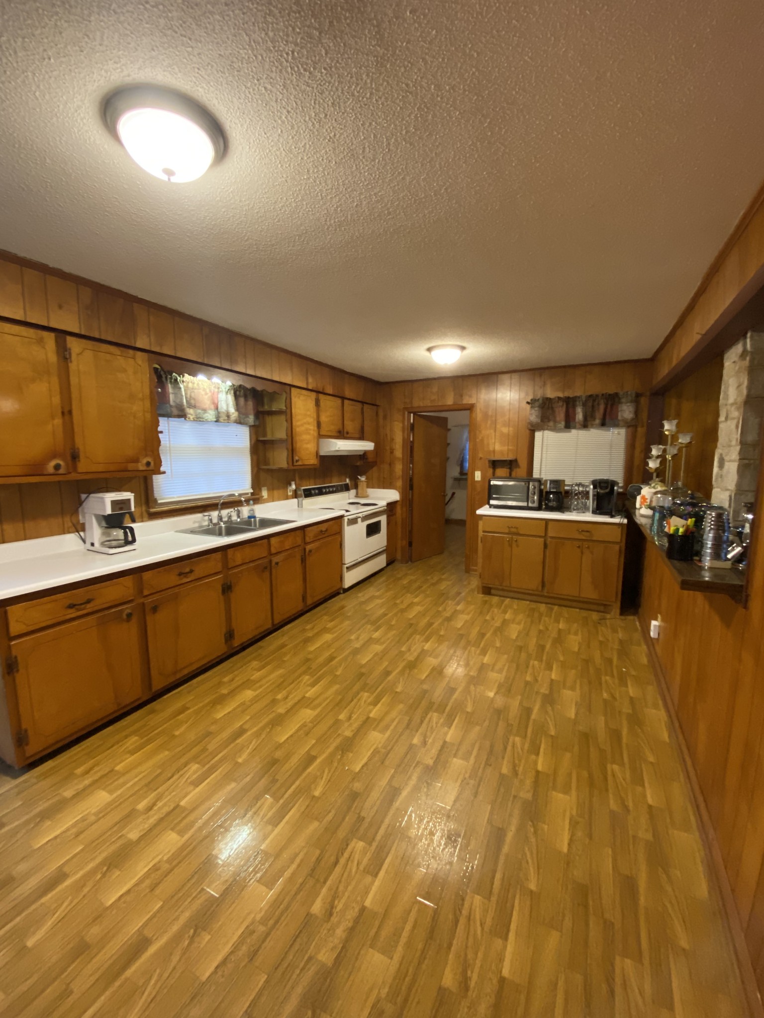 251 Rascal Town Road Loretto, TN 38469 - Photo 10 of 52 a large kitchen with stainless steel appliances lots of counter space and a sink