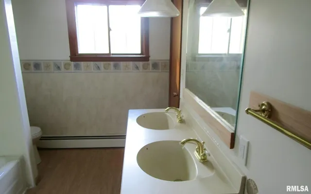 a bathroom with a sink and mirror