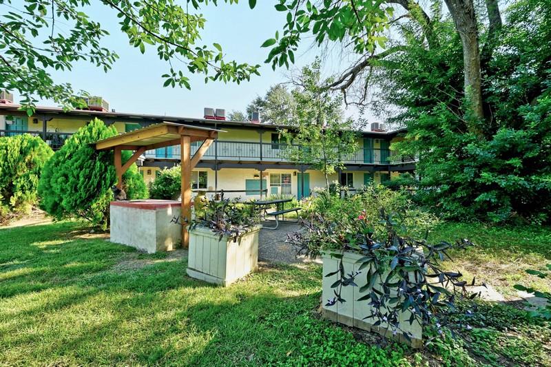 711 Eberhart Lane, Unit 202 Austin, TX 78745 - Photo 6 of 7 a view of a chair and table in the garden