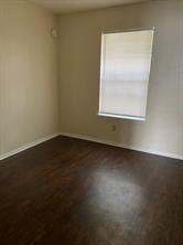 2507 Stella Street, Unit C Denton, TX 76201 - Photo 5 of 5 an empty room with a window