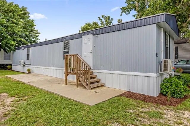 a view of backyard with a garden and stairs