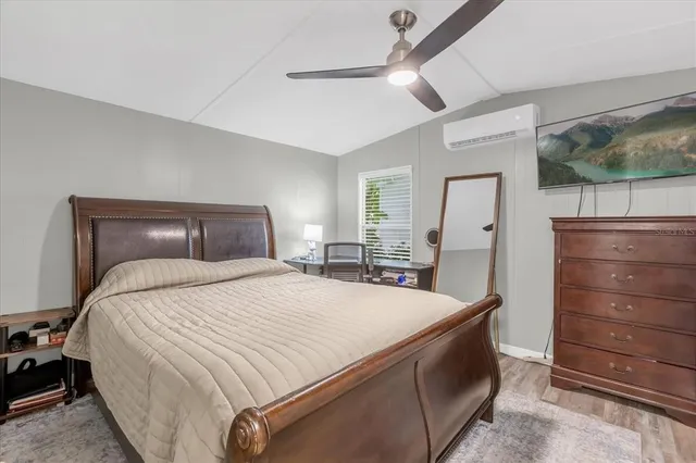 a bedroom with a bed and a dresser