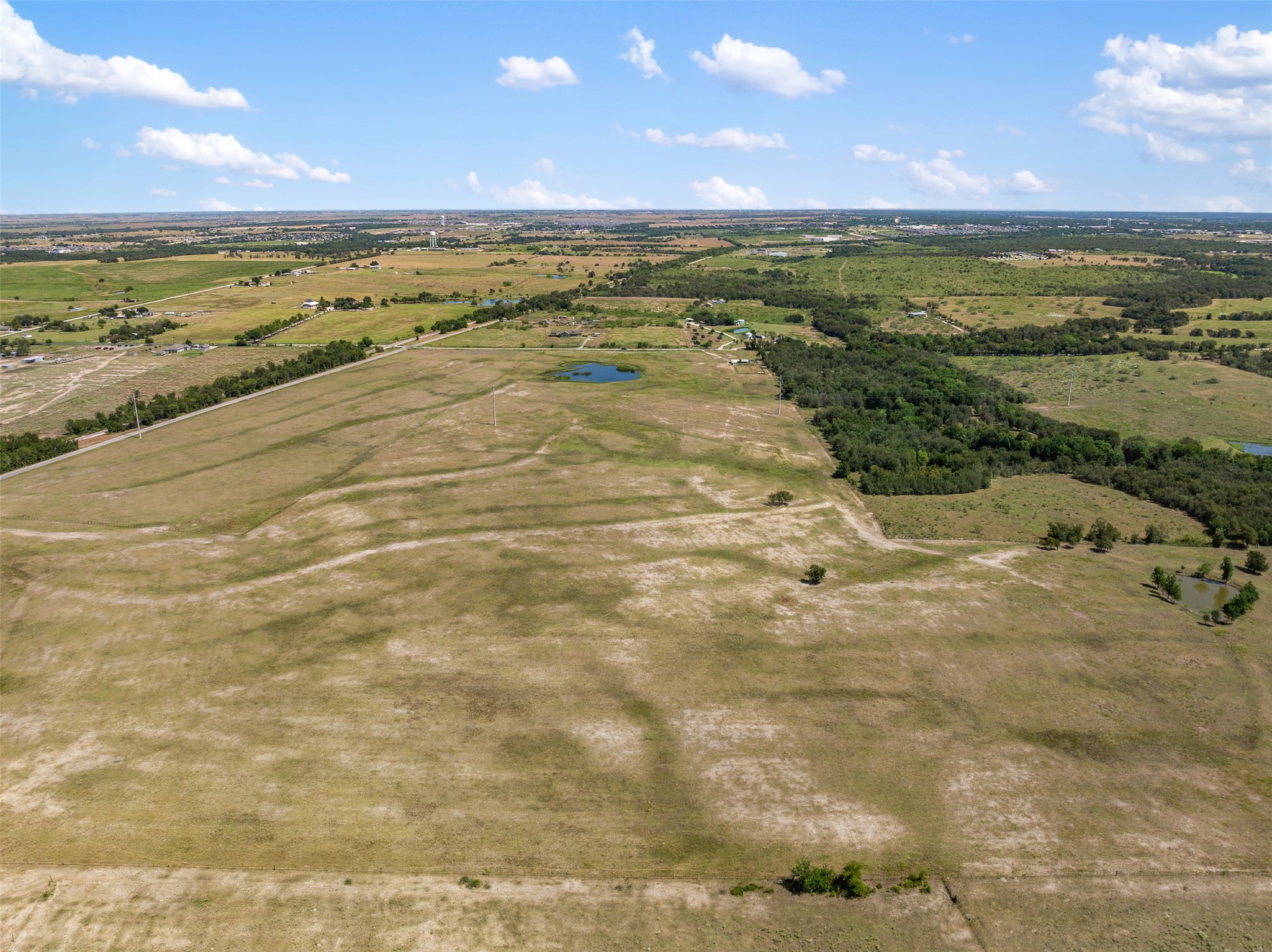 -littig Rd Littig Road Elgin, TX 78621 - Photo 12 of 37 Aerial view of sparsely populated area featuring a nearby body of water