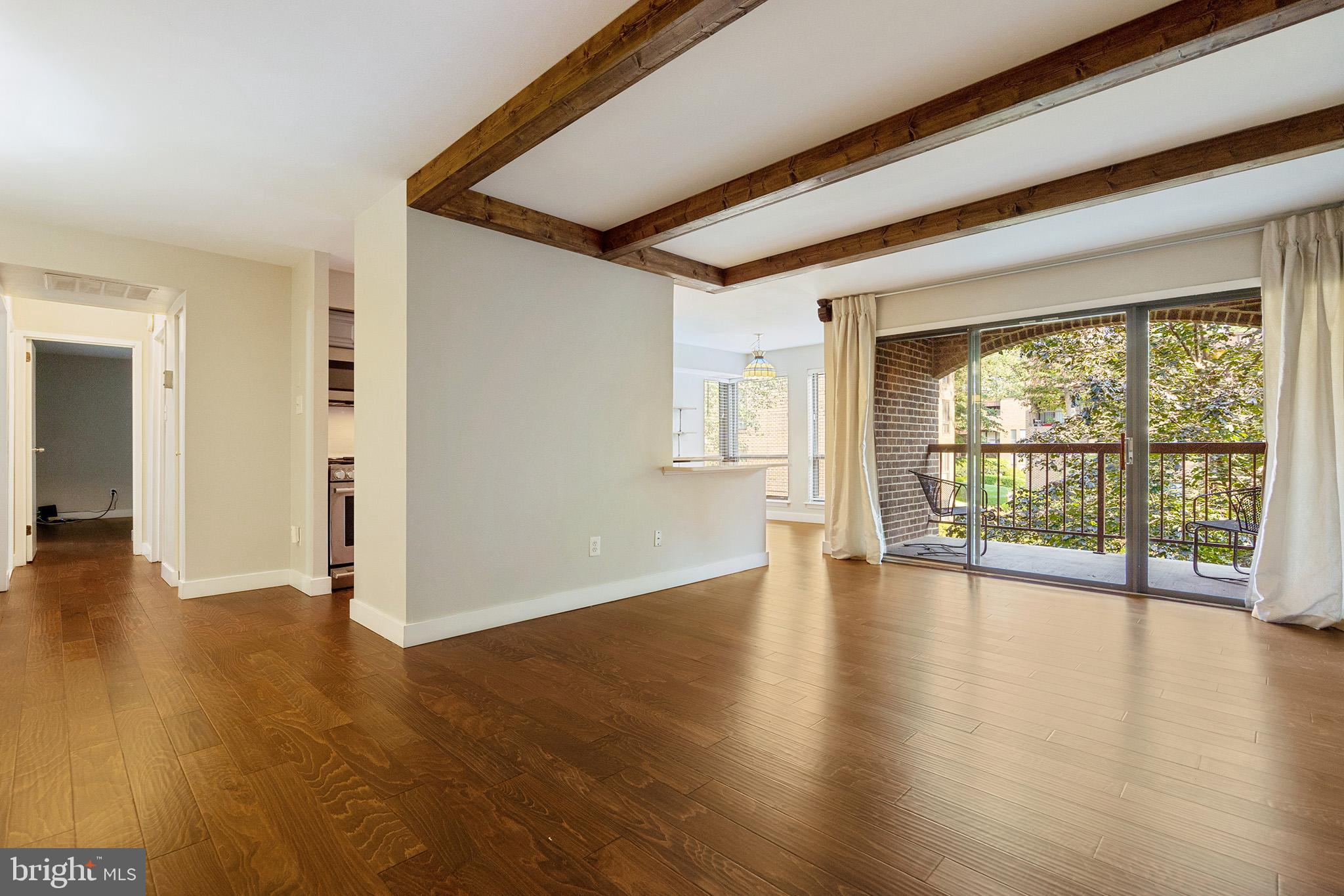 11216 Chestnut Grove Square, Unit 11216220 Reston, VA 20190 - Photo 2 of 18 Living room with hardwood flooring