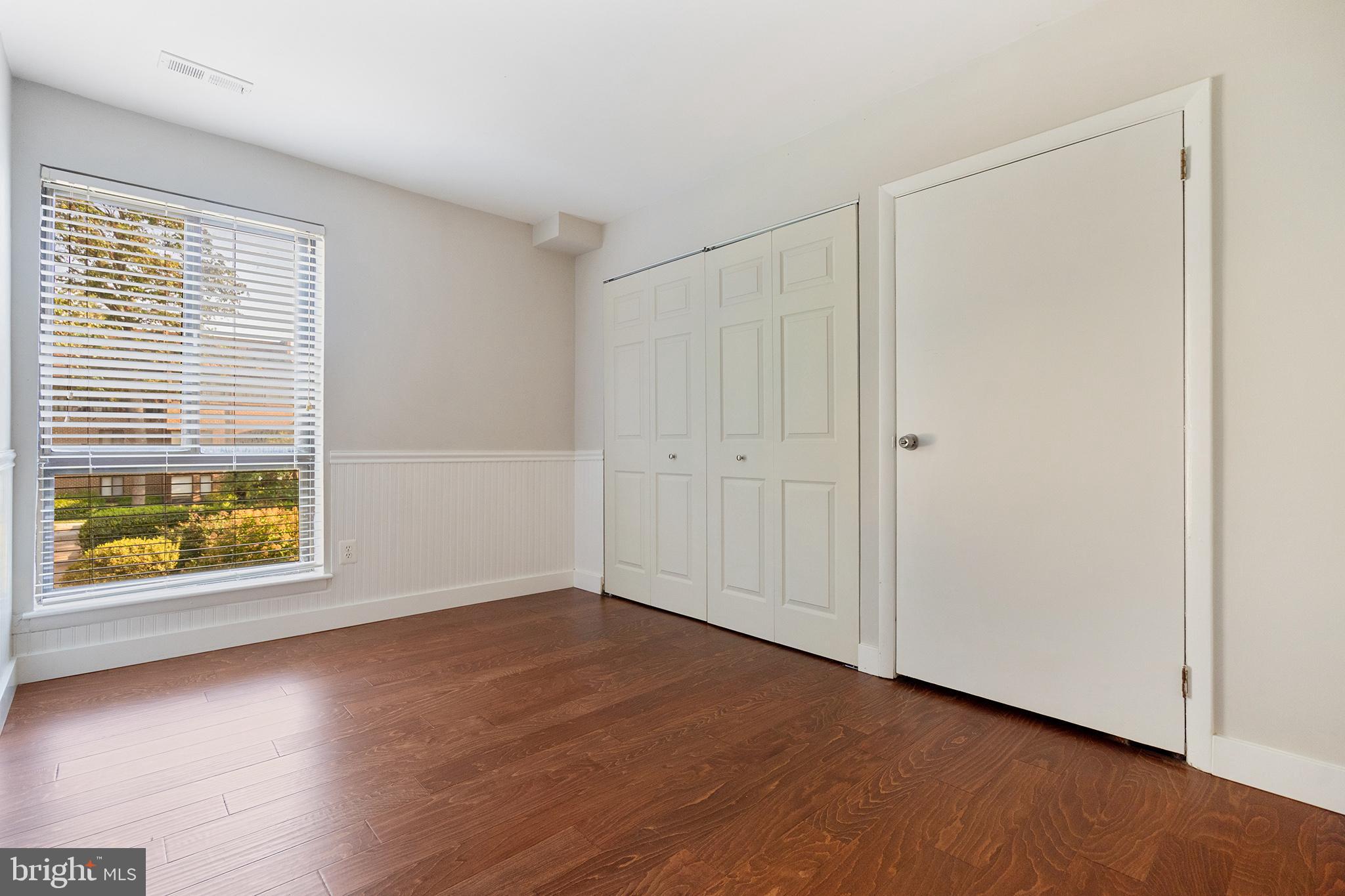 11216 Chestnut Grove Square, Unit 11216220 Reston, VA 20190 - Photo 11 of 18 Bedroom 1 with hardwoods and large closet