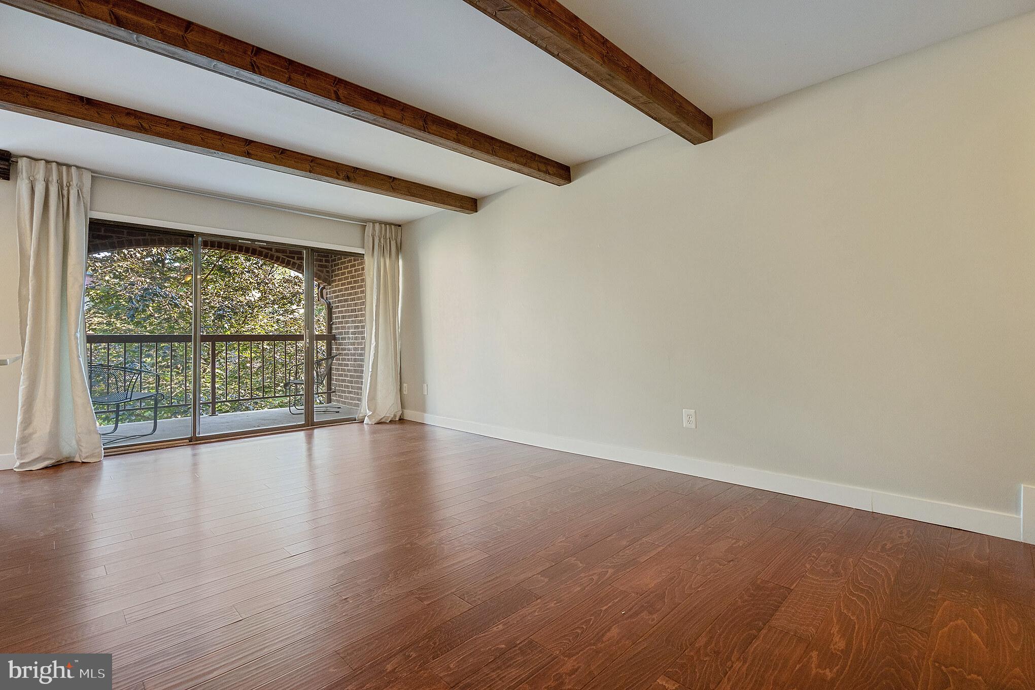 11216 Chestnut Grove Square, Unit 11216220 Reston, VA 20190 - Photo 3 of 18 Tons of natural light - beamed ceilings