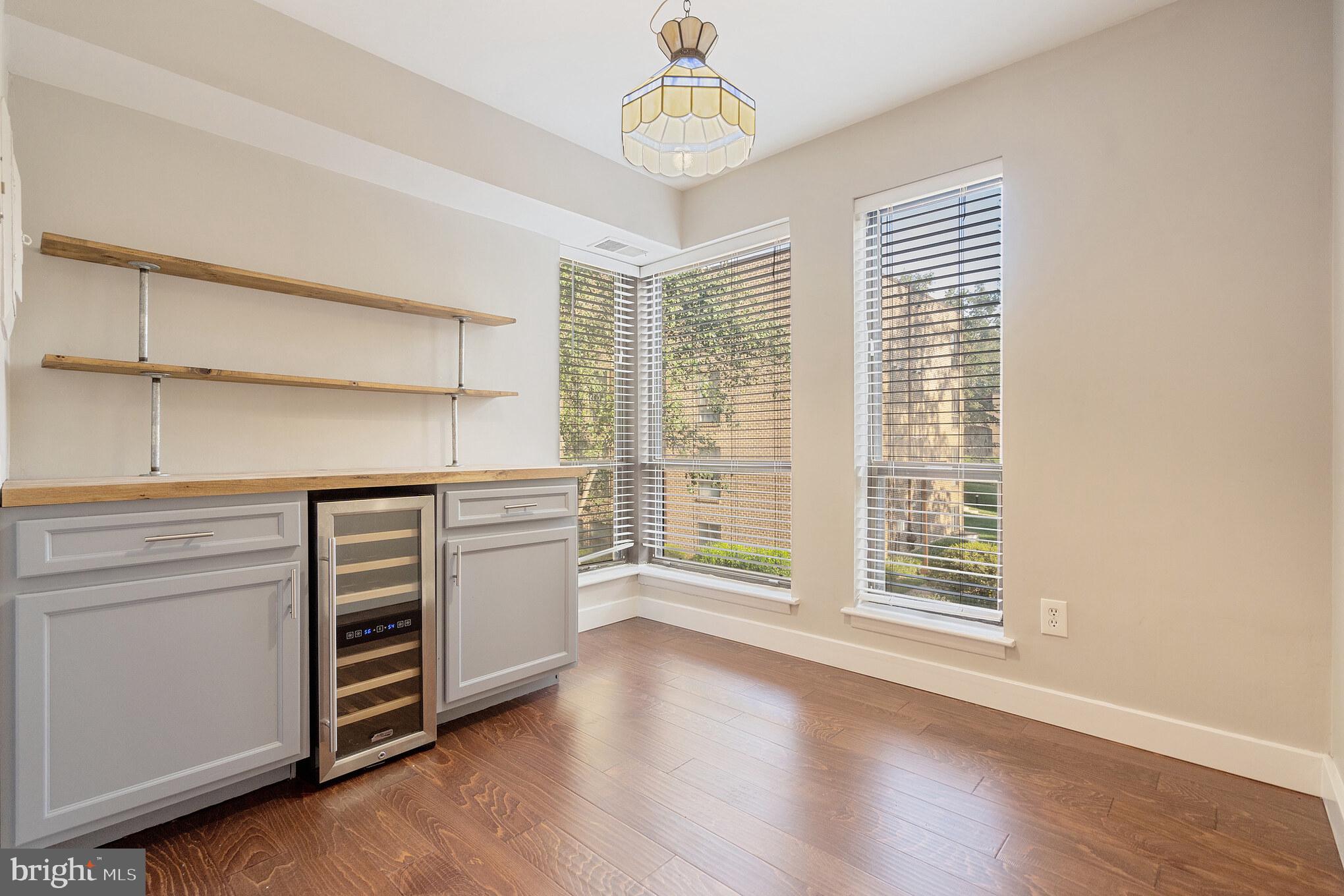 11216 Chestnut Grove Square, Unit 11216220 Reston, VA 20190 - Photo 8 of 18 Sitting room with coffee bar & wine fridge