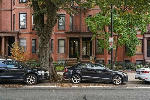 a car parked in front of a house