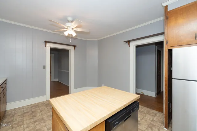 a room with closet and ceiling fan