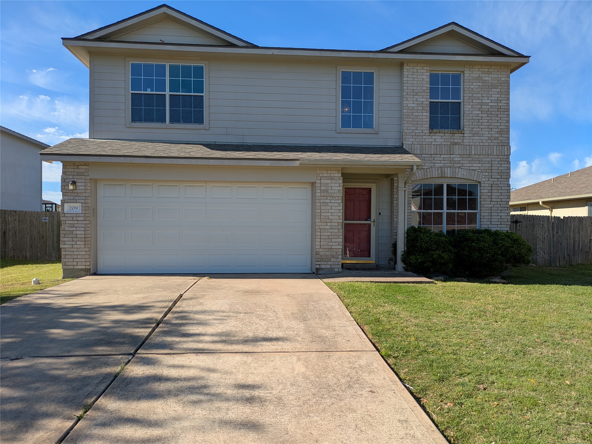 a front view of a house with yard