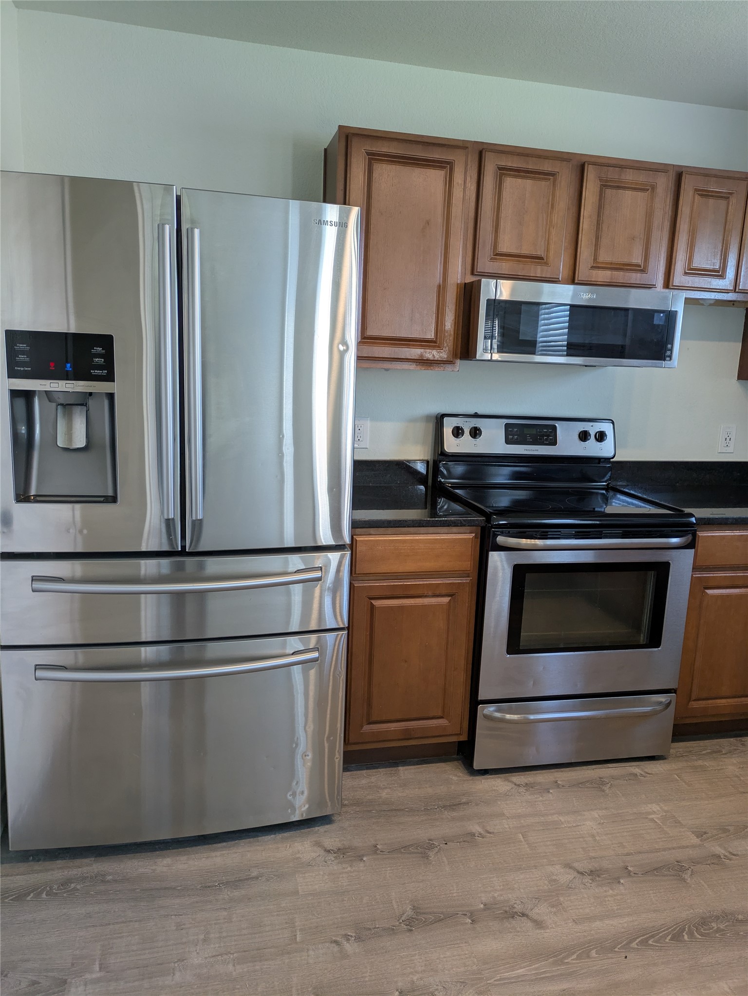 209 Phillips Street Hutto, TX 78634 - Photo 3 of 11 a kitchen with appliances and cabinets