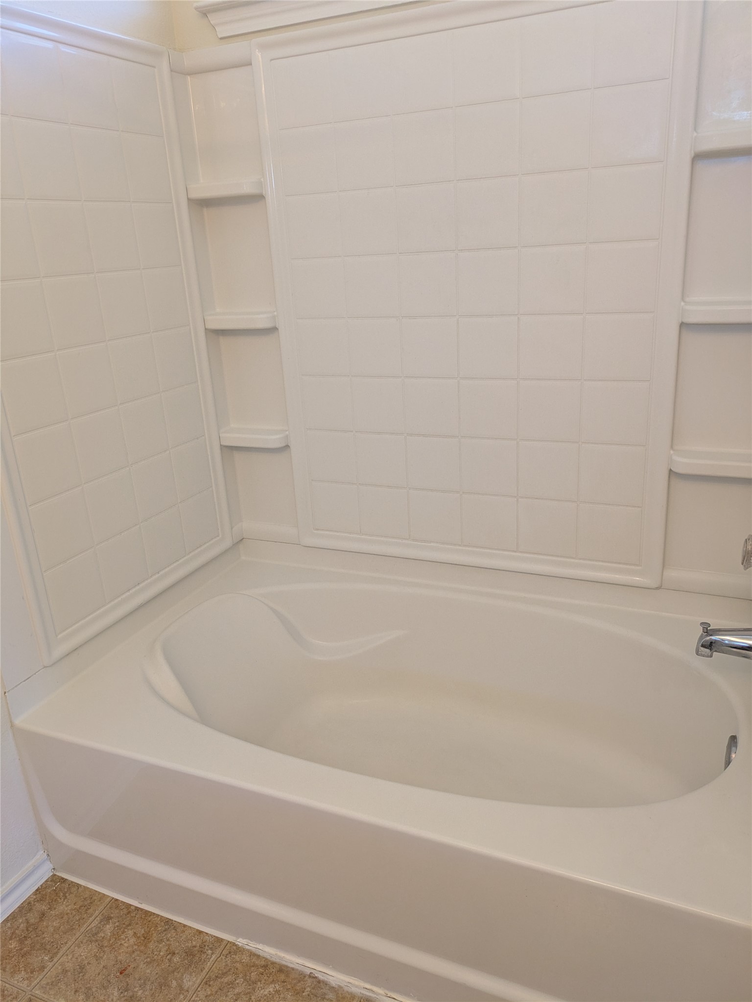 209 Phillips Street Hutto, TX 78634 - Photo 8 of 11 a bathroom with a bathtub