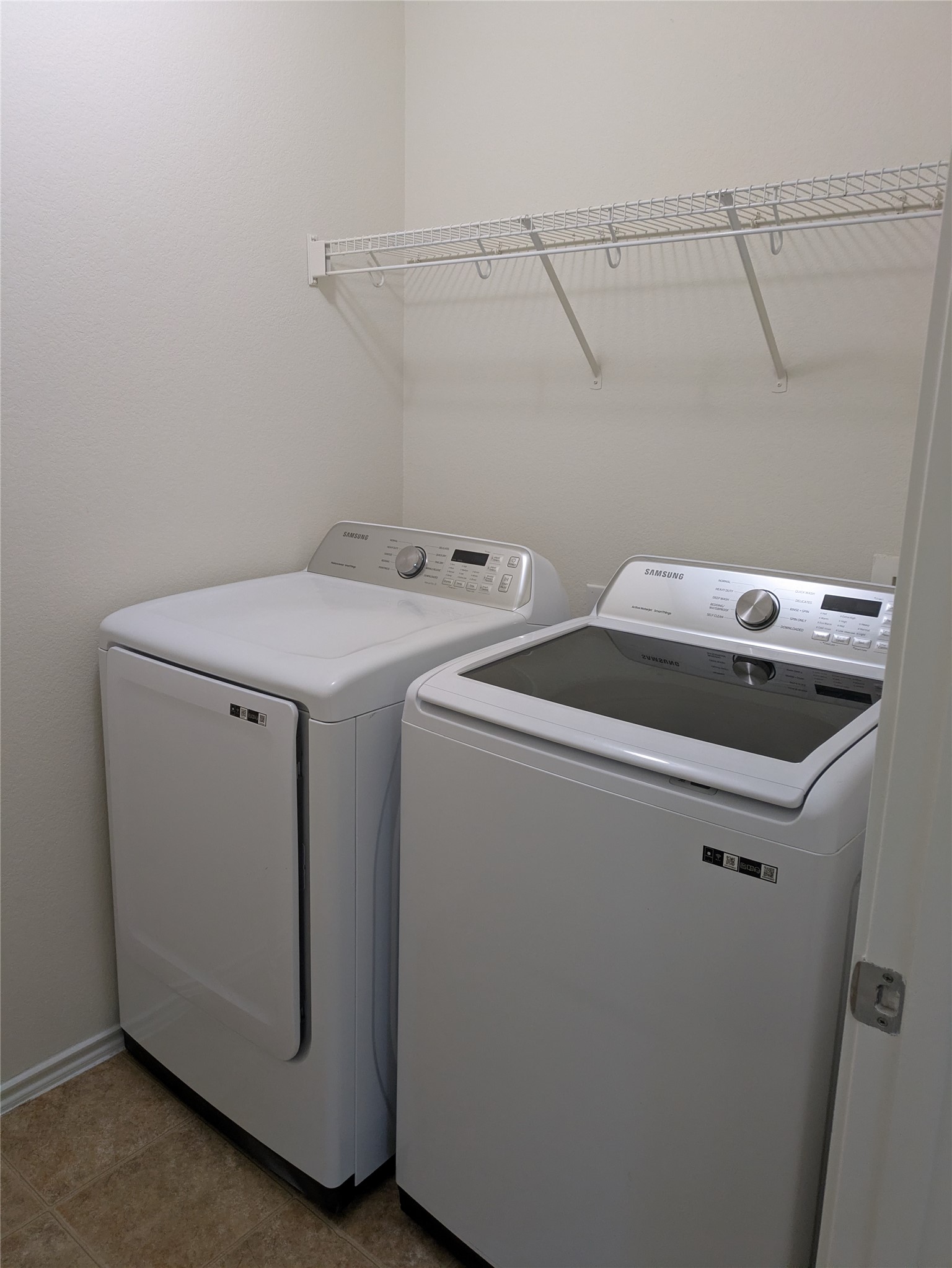 209 Phillips Street Hutto, TX 78634 - Photo 9 of 11 a utility room with dryer and washer