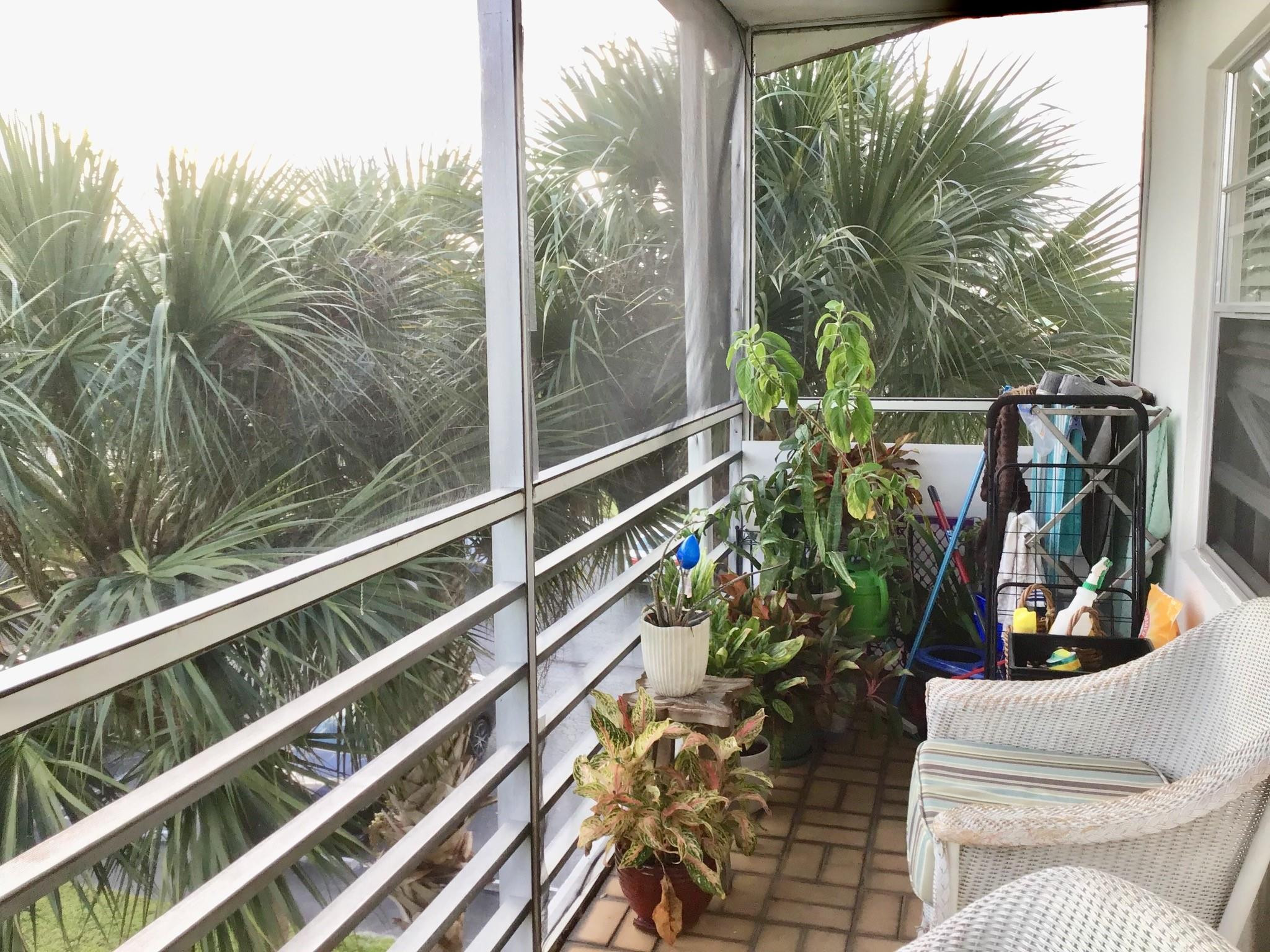 84 Brighton B, Unit 84 Boca Raton, FL 33434 - Photo 15 of 28 a view of a balcony with chairs and a potted plant