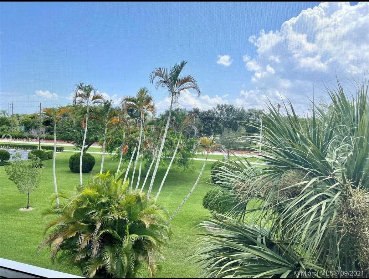 84 Brighton B, Unit 84 Boca Raton, FL 33434 - Photo 16 of 28 a view of a lake in a backyard of a house
