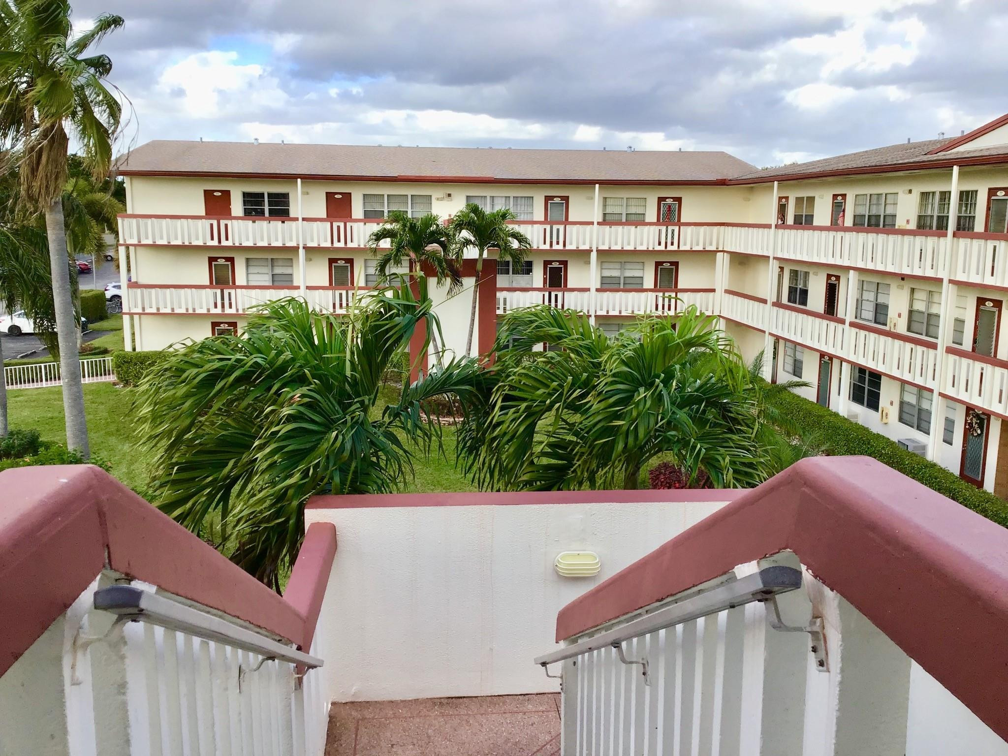 84 Brighton B, Unit 84 Boca Raton, FL 33434 - Photo 20 of 28 a view of a city with tall buildings
