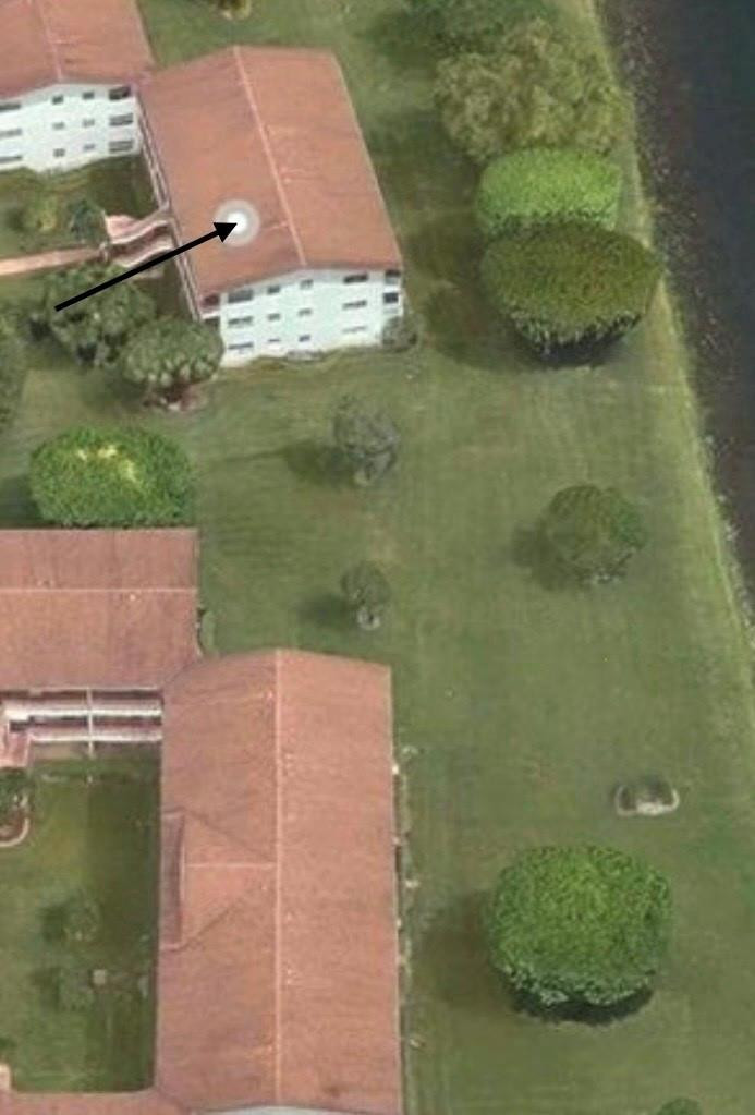 84 Brighton B, Unit 84 Boca Raton, FL 33434 - Photo 21 of 28 an aerial view of a house with a yard