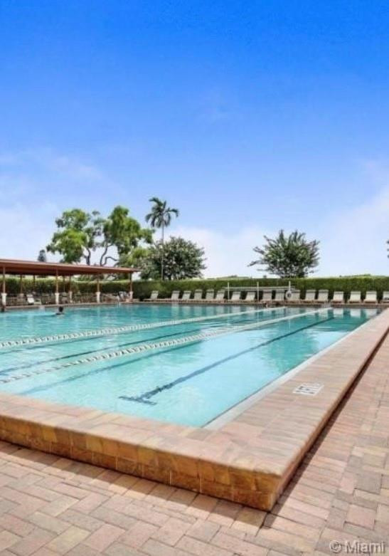 84 Brighton B, Unit 84 Boca Raton, FL 33434 - Photo 24 of 28 a view of a golf course with a lake