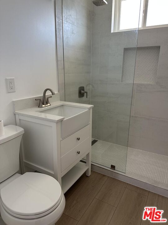 12610 Caswell Avenue, Unit 4 Los Angeles, CA 90066 - Photo 12 of 16 a bathroom with a sink toilet and shower