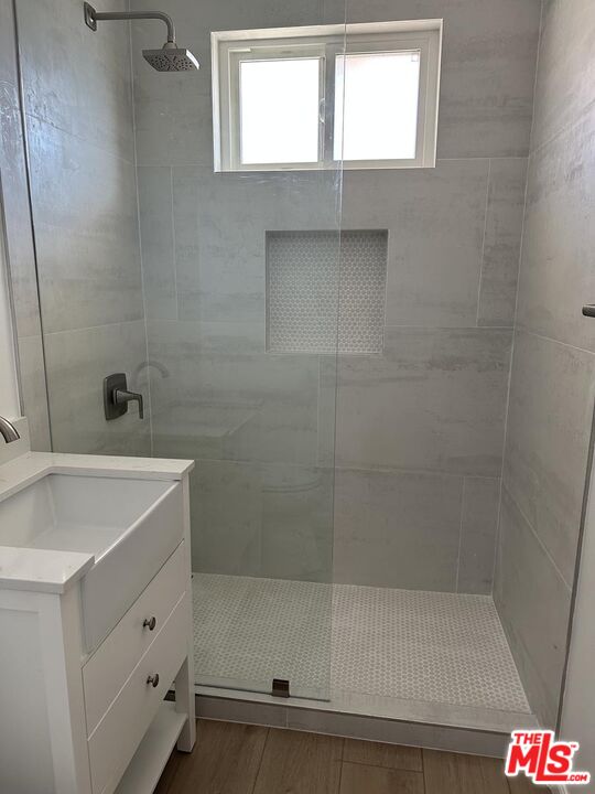12610 Caswell Avenue, Unit 4 Los Angeles, CA 90066 - Photo 13 of 16 a bathroom with a bathtub and shower