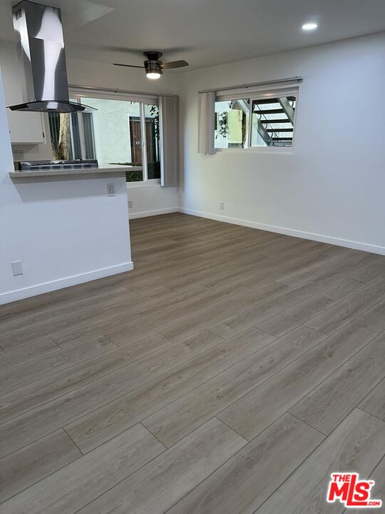 12610 Caswell Avenue, Unit 4 Los Angeles, CA 90066 - Photo 3 of 16 a view of kitchen and kitchen with wooden floor