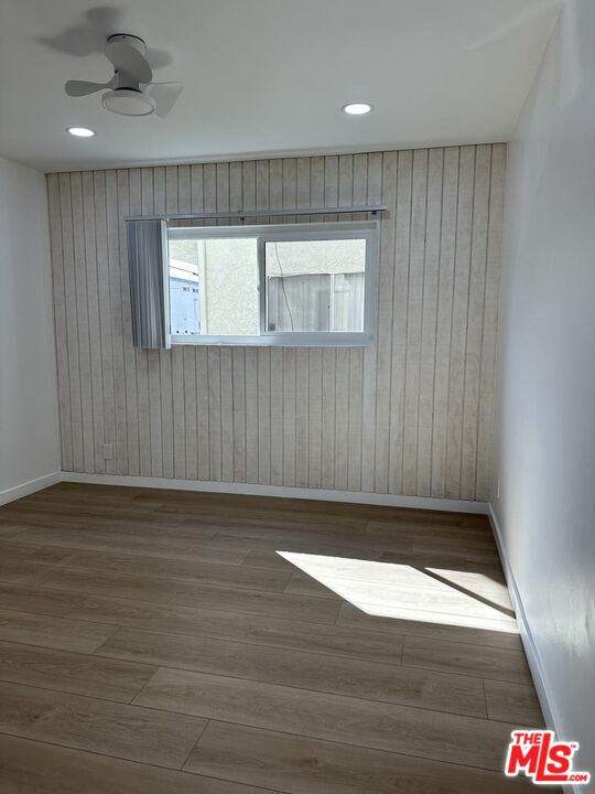 12610 Caswell Avenue, Unit 4 Los Angeles, CA 90066 - Photo 9 of 16 a view of an empty room with wooden floor