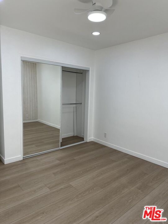 12610 Caswell Avenue, Unit 4 Los Angeles, CA 90066 - Photo 10 of 16 an empty room with wooden floor