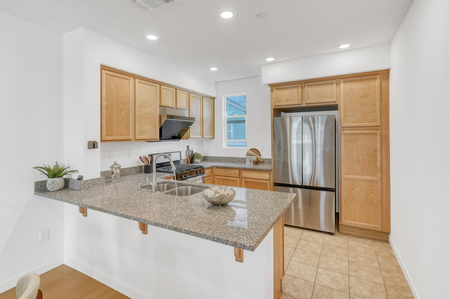 1425 Lavender Loop Milpitas, CA 95035 - Photo 11 of 59 a kitchen with stainless steel appliances granite countertop a sink and a refrigerator