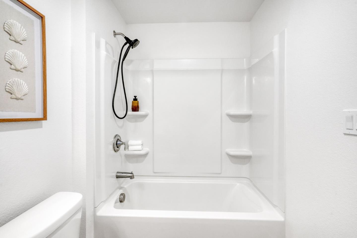 1425 Lavender Loop Milpitas, CA 95035 - Photo 20 of 59 a bathroom with a bath tub with a shower