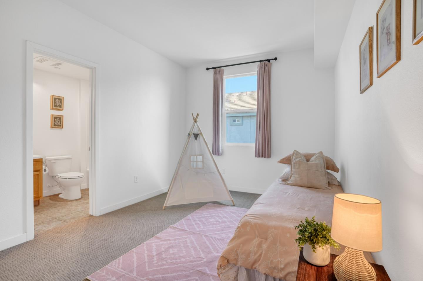 1425 Lavender Loop Milpitas, CA 95035 - Photo 26 of 59 a bedroom with a bed and a window