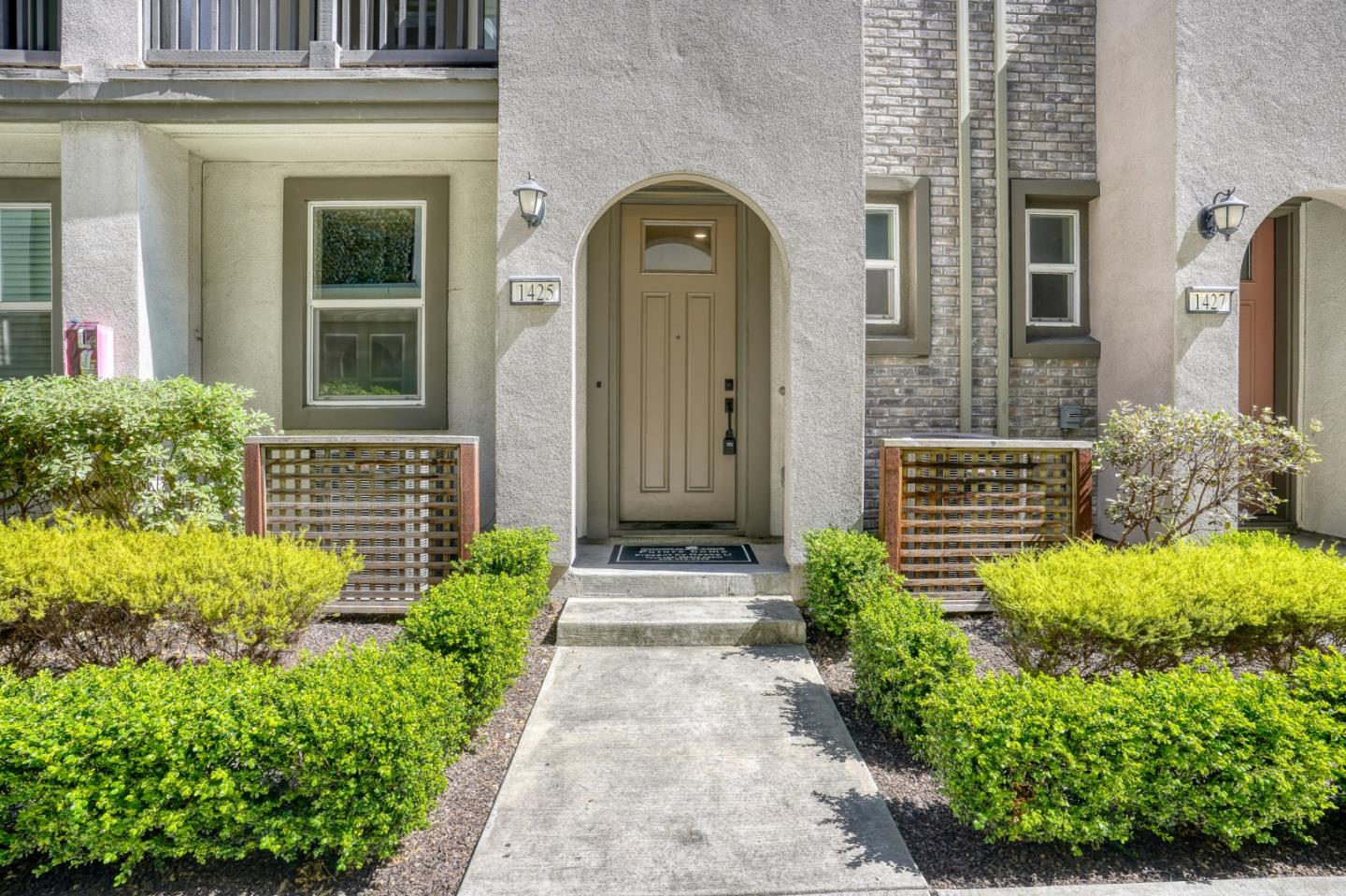 1425 Lavender Loop Milpitas, CA 95035 - Photo 3 of 59 a front view of a house with a garden