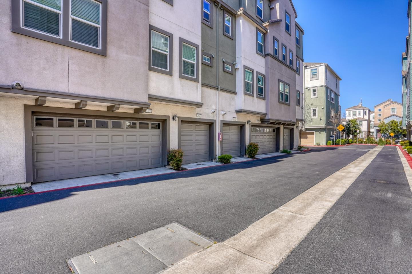 1425 Lavender Loop Milpitas, CA 95035 - Photo 35 of 59 a front view of a building with a road
