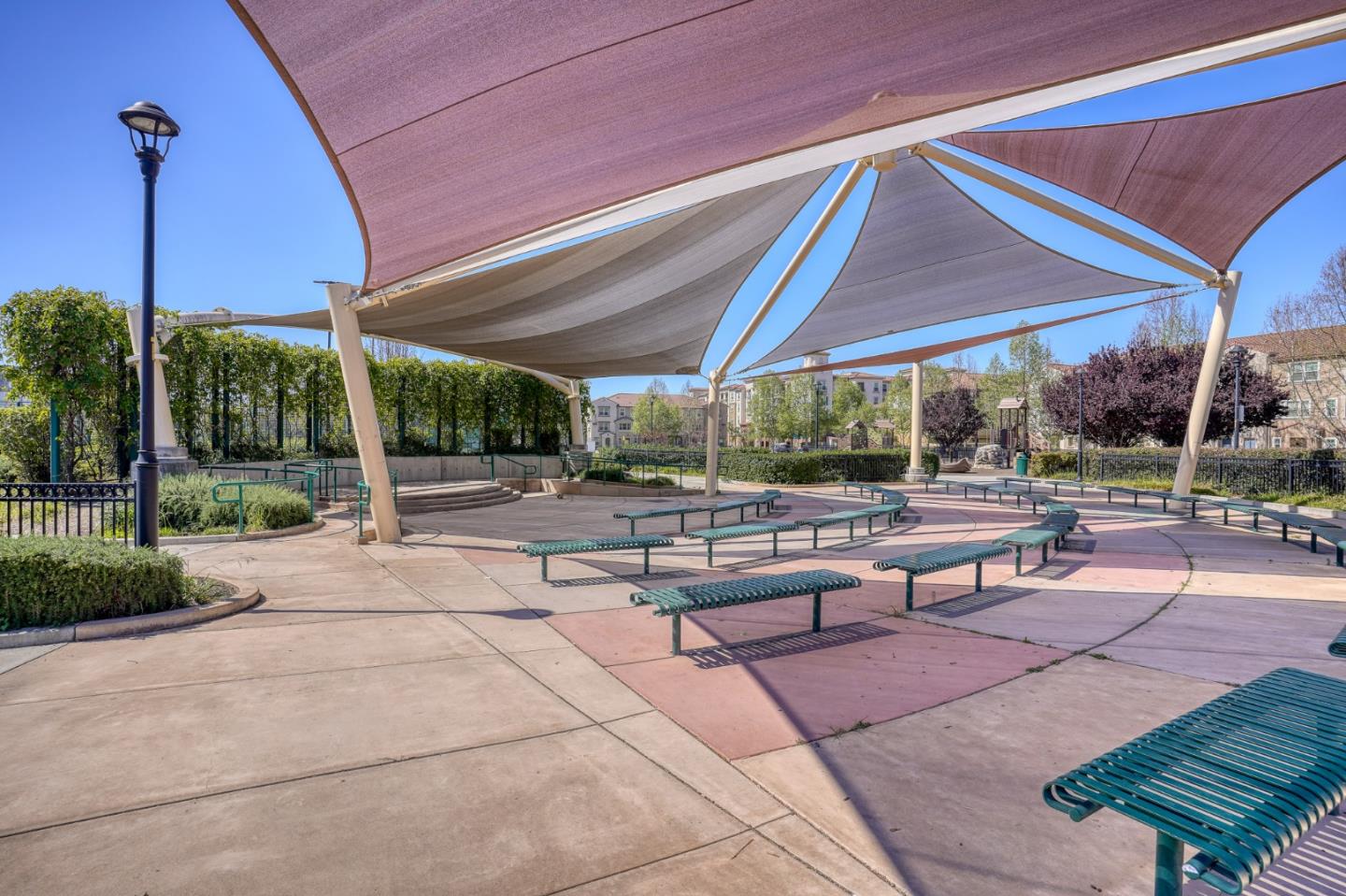 1425 Lavender Loop Milpitas, CA 95035 - Photo 38 of 59 a view of a patio with a table and chairs under an umbrella