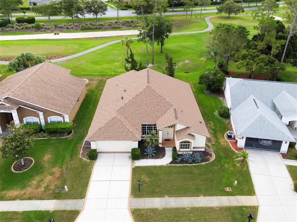 11228 Windrush Circle Hudson, FL 34667 - Photo 54 of 67 an aerial view of a house with a yard