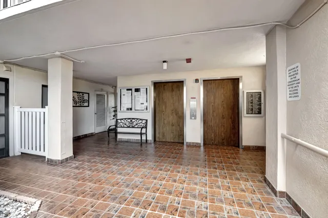 a view of a dining room with furniture and window