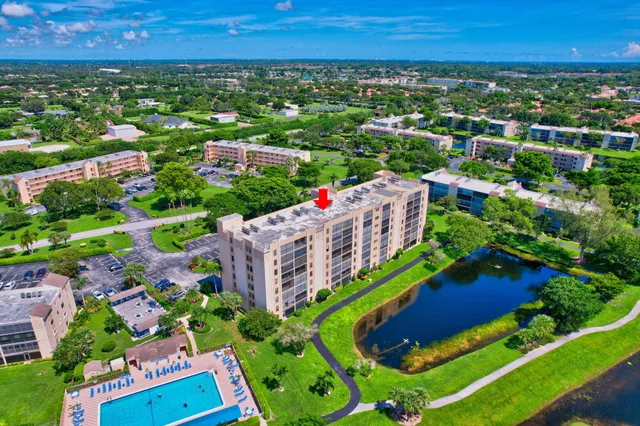 a view of a hallway with wooden floor and entryway