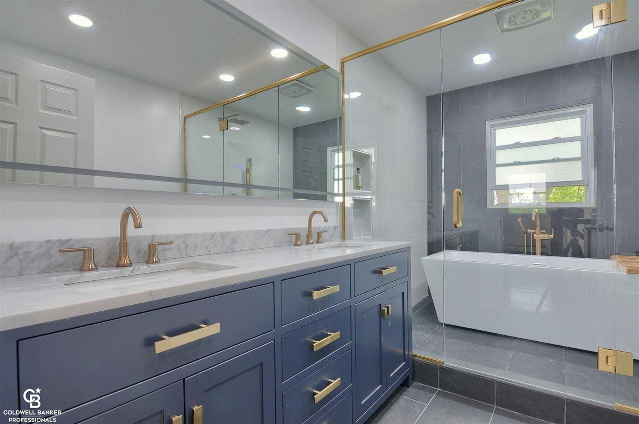 10027 Hogan Road Swartz Creek, MI 48473 - Photo 6 of 37 What a wonderful Washroom!!! Everything from heated floors, to High tech mirror, even a WIFI equipped ceiling speaker/fan with lights!!
