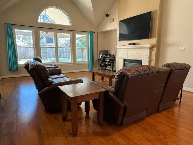 a living room with furniture and a flat screen tv