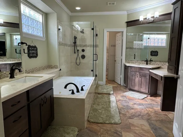 a spacious bathroom with a sink double vanity and a mirror