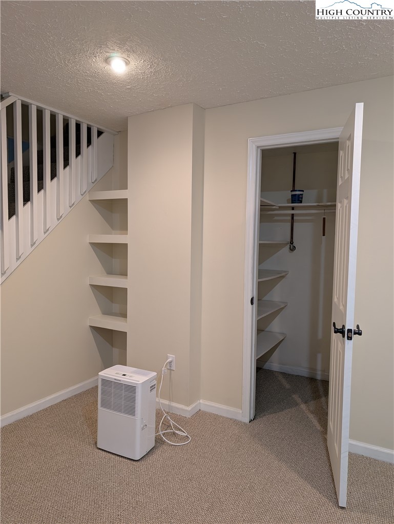 57 Village Road Glade Valley, NC 28627 - Photo 31 of 47 a view of an empty room and a walk in closet