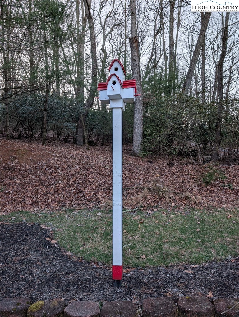 57 Village Road Glade Valley, NC 28627 - Photo 41 of 47 a front view of a house with a yard and trees